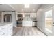 Updated kitchen featuring white cabinets and stainless steel appliances at 1631 Granada Ave, Daytona Beach, FL 32117