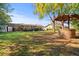 Serene backyard with a well, providing ample space and shade at 1639 Templewood Ave, Deltona, FL 32725
