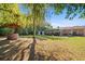 Spacious backyard featuring a well, mature trees, and a large grassy area at 1639 Templewood Ave, Deltona, FL 32725