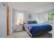 Bright bedroom with a blue comforter and two nightstands at 1639 Templewood Ave, Deltona, FL 32725