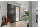 Home entryway with dark door and tiled floor at 1639 Templewood Ave, Deltona, FL 32725