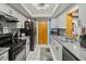 Kitchen with gray countertops, stainless steel appliances, and a black refrigerator at 1639 Templewood Ave, Deltona, FL 32725