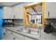 Kitchen with gray countertops, stainless steel appliances, and a black refrigerator at 1639 Templewood Ave, Deltona, FL 32725