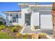 Front entrance with walkway, landscaping, and two-car garage at 168 Azure Ct, Daytona Beach, FL 32124