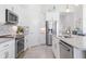 Modern kitchen with stainless steel appliances and white cabinets at 168 Azure Ct, Daytona Beach, FL 32124