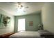 Bedroom with bed, ceiling fan, and nautical-themed art at 1831 Trumbull St, Deltona, FL 32725