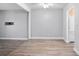 Dining area with wood-look tile floors and ceiling fan at 2 Fair Oaks Cir, Ormond Beach, FL 32174