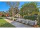 Cute house with white picket fence and well-manicured lawn at 201 W Chancery Ln, Deland, FL 32724