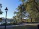 Tranquil lakeside walkway with benches at 201 W Chancery Ln, Deland, FL 32724