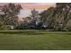 Spacious backyard with green grass and trees at 2236 River Ridge Rd, Deland, FL 32720