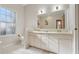 Bathroom with double vanity, mirror, and tiled floor at 2236 River Ridge Rd, Deland, FL 32720