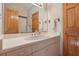 Bathroom with single vanity, mirror, and wood cabinets at 2236 River Ridge Rd, Deland, FL 32720