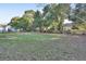 Spacious backyard with grassy area and mature trees at 2585 Delbarton Ave, Deltona, FL 32725