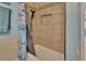 Bathroom with tub, shower, and neutral colored tile at 2585 Delbarton Ave, Deltona, FL 32725