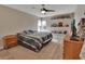 Spacious bedroom with wood floors, ceiling fan, and ample closet space at 2585 Delbarton Ave, Deltona, FL 32725