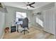 Bedroom with wood-look flooring, a desk, and gaming chair at 2585 Delbarton Ave, Deltona, FL 32725