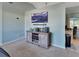 Large TV mounted on wall, gray wood media console, and carpeted floor at 2585 Delbarton Ave, Deltona, FL 32725