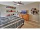 Large bedroom with wood-look flooring, a dresser, and built-in shelving at 2585 Delbarton Ave, Deltona, FL 32725