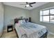 Bedroom with light gray walls, wood-look flooring, and a bed at 2585 Delbarton Ave, Deltona, FL 32725