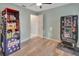 Bedroom with wood-look flooring, storage, and a birdcage at 2585 Delbarton Ave, Deltona, FL 32725