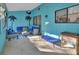 Bright Florida room with seating area and tropical wall art at 2585 Delbarton Ave, Deltona, FL 32725