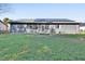 Home's exterior features a metal roof and solar panels at 2585 Delbarton Ave, Deltona, FL 32725