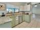 Bright kitchen with granite countertops and stainless steel appliances at 2585 Delbarton Ave, Deltona, FL 32725