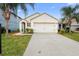 Single-story house with a two-car garage and front yard landscaping at 2924 Taton Trce, New Smyrna Beach, FL 32168