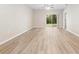 Bright living room with vinyl flooring and sliding glass doors leading to backyard at 2924 Taton Trce, New Smyrna Beach, FL 32168