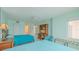 Bedroom with two beds and built-in desk, creating a functional and comfortable space at 2967 S Atlantic Ave # 204, Daytona Beach Shores, FL 32118