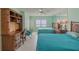 Bedroom with two beds and built-in desk, offering flexible space options at 2967 S Atlantic Ave # 204, Daytona Beach Shores, FL 32118