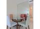 Bright dining area with glass table and four chairs, offering a space for meals at 2967 S Atlantic Ave # 204, Daytona Beach Shores, FL 32118