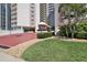 Building entrance with landscaping and a welcoming atmosphere at 2967 S Atlantic Ave # 204, Daytona Beach Shores, FL 32118