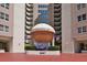 Oceans Six Condominium building entrance, featuring a covered walkway and landscaping at 2967 S Atlantic Ave # 204, Daytona Beach Shores, FL 32118