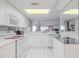 White kitchen with view to living room and ocean, offering a bright and open feel at 2967 S Atlantic Ave # 204, Daytona Beach Shores, FL 32118