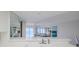 Kitchen with breakfast bar and view to living room, offering an open floor plan at 2967 S Atlantic Ave # 204, Daytona Beach Shores, FL 32118