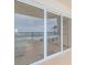 Stunning ocean view from condo balcony, featuring sliding glass doors at 2967 S Atlantic Ave # 204, Daytona Beach Shores, FL 32118