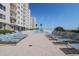 Inviting pool area with multiple lounge chairs at 2967 S Atlantic Ave # 204, Daytona Beach Shores, FL 32118