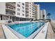 Refreshing swimming pool with plenty of lounge chairs at 2967 S Atlantic Ave # 204, Daytona Beach Shores, FL 32118