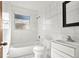 Clean bathroom with a bathtub, toilet, and sink at 4910 Huppel Ave, Orlando, FL 32811