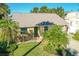 Cute yellow house with green door and palm trees at 503 Phoenix Ave, Daytona Beach, FL 32118