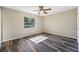 Spacious bedroom with wood-look floors and ceiling fan at 517 Dustin Ter, Deltona, FL 32725