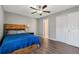 Bright bedroom with wood floors, ceiling fan, and built-in storage at 610 Nardello Dr, Deltona, FL 32725