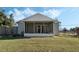 House exterior with screened porch and fenced backyard at 610 Nardello Dr, Deltona, FL 32725