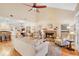 Living room with hardwood floors, brick fireplace and vaulted ceiling at 624 E Old Mill Dr, Debary, FL 32713