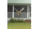 Red-shouldered hawk in flight near home's porch at 624 E Old Mill Dr, Debary, FL 32713