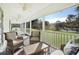 Relaxing screened porch with wicker furniture at 624 E Old Mill Dr, Debary, FL 32713