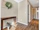 Light and bright hallway with wood-look flooring at 636 Preakness Cir, Deland, FL 32724