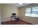 Bright home office features wood floors, large window, and workspace at 741 Horseman Dr, Port Orange, FL 32127