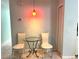 Small breakfast nook with glass table and chairs at 101 N Hill S Ave # 7, Deland, FL 32724